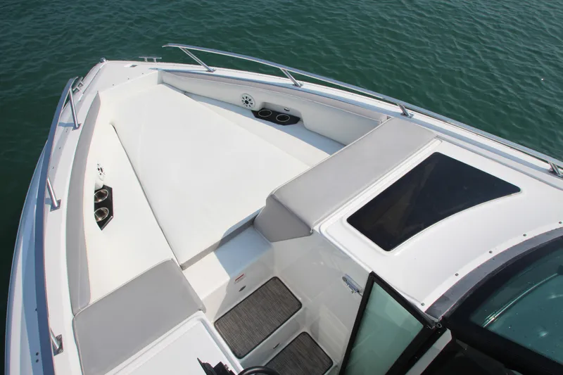  Yacht Photos Pics 2018 Cobalt A36 boat deck with cushioned seating and railing on calm water.