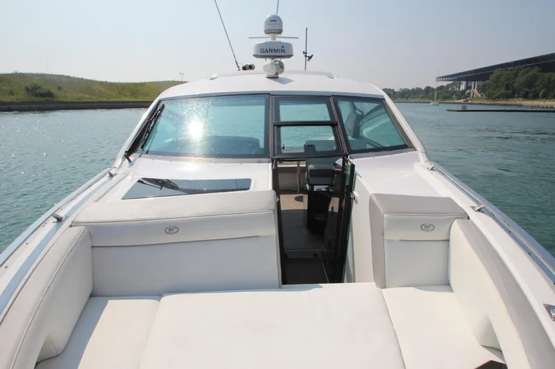  Yacht Photos Pics 2018 Cobalt A36 boat with white seating, cruising on a sunny day.