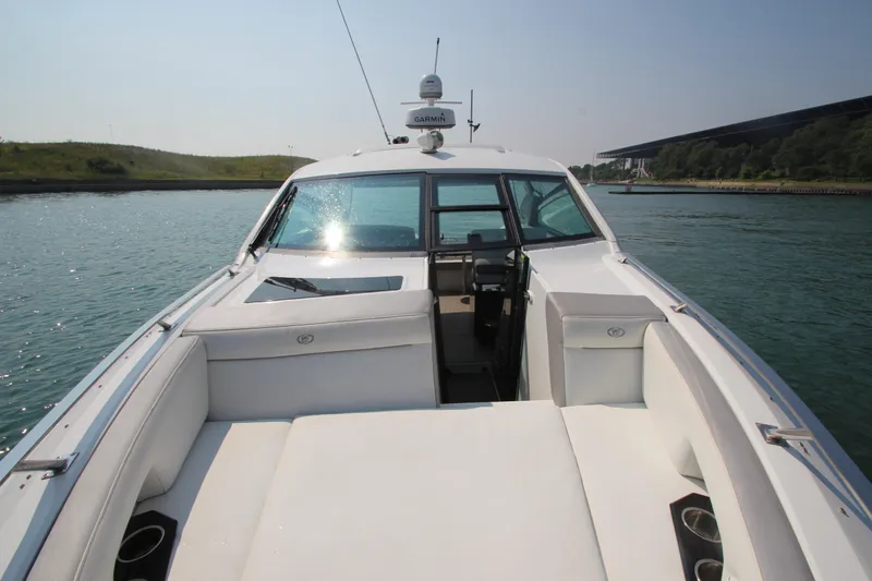  Yacht Photos Pics 2018 Cobalt A36 boat with white seating, cruising on a sunny day.