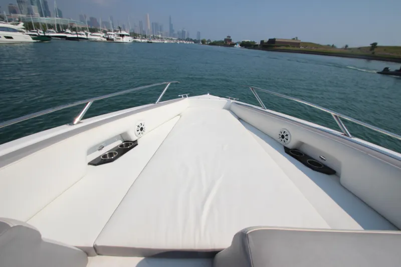  Yacht Photos Pics 2018 Cobalt A36 boat with spacious deck, cup holders, and scenic waterfront view.
