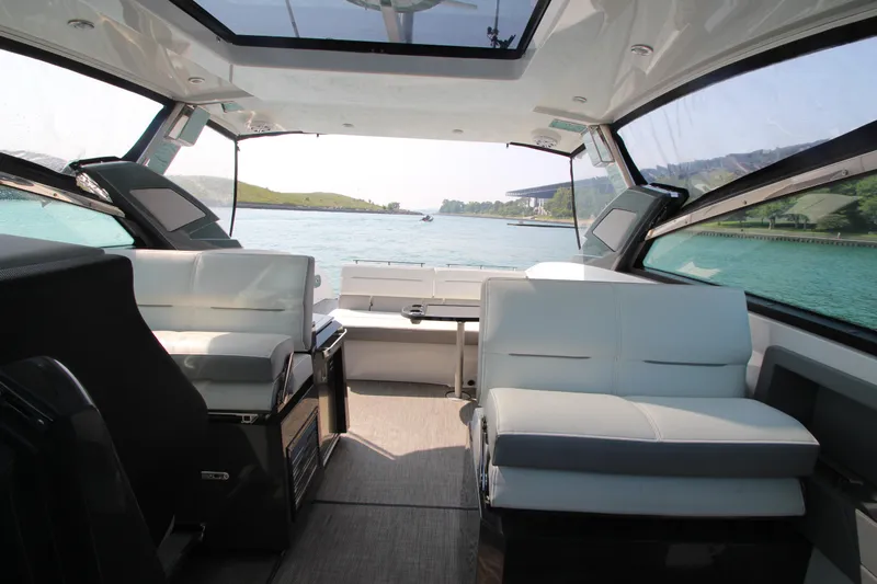  Yacht Photos Pics Interior of 2018 Cobalt A36 boat with spacious seating and scenic water view.