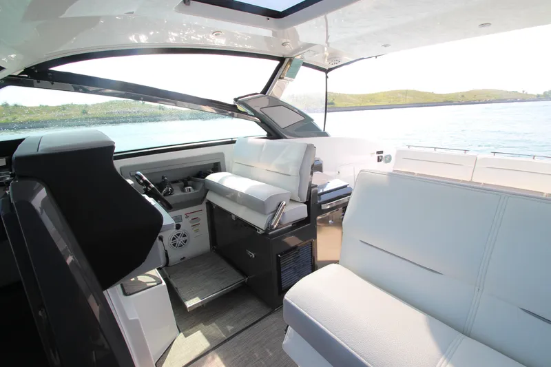  Yacht Photos Pics Interior of 2018 Cobalt A36 boat with luxurious seating and scenic water view.