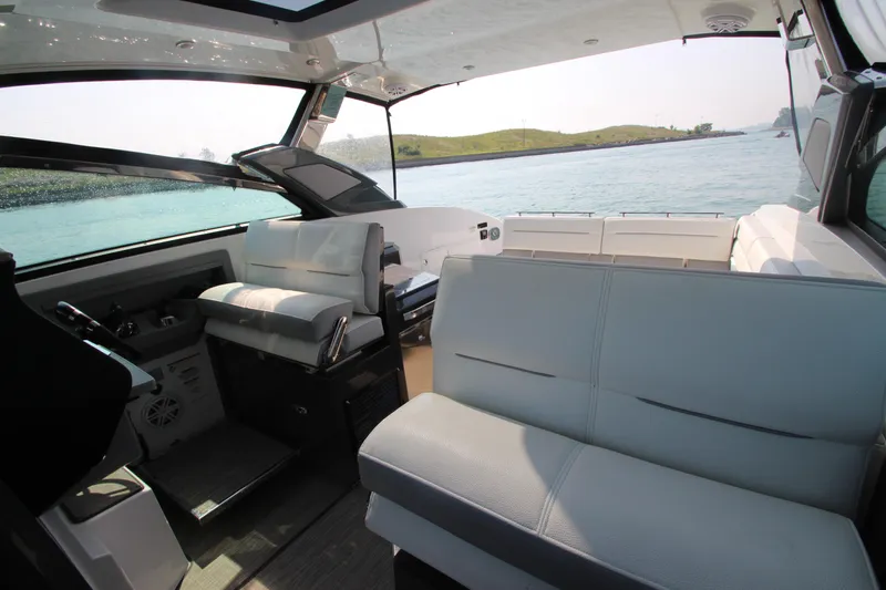  Yacht Photos Pics Interior of a 2018 Cobalt A36 boat with luxurious seating and scenic water view.