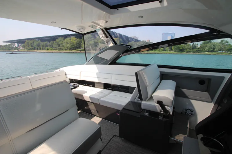  Yacht Photos Pics Interior of 2018 Cobalt A36 boat with luxurious seating and scenic water view.