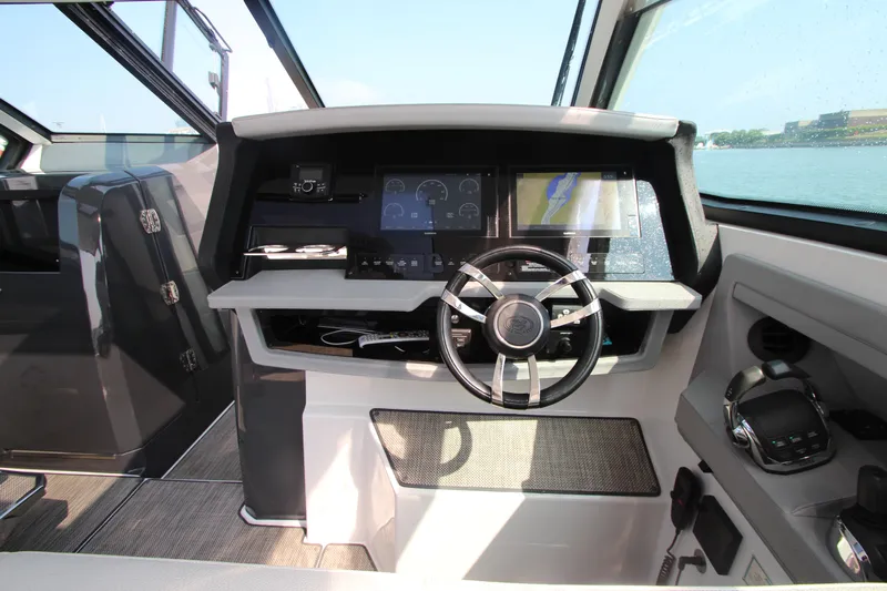  Yacht Photos Pics Cockpit of 2018 Cobalt A36 boat with modern steering and navigation displays.