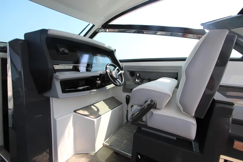  Yacht Photos Pics Interior helm of 2018 Cobalt A36 boat with modern steering and controls.