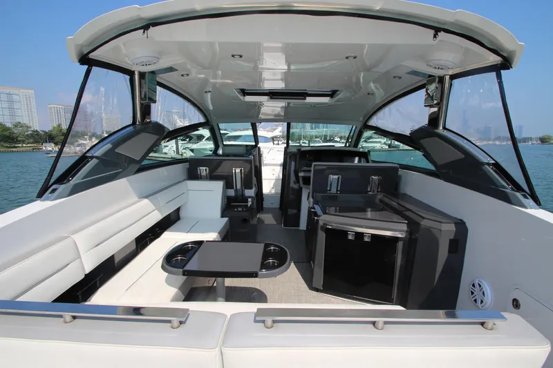  Yacht Photos Pics Luxurious 2018 Cobalt A36 boat interior with seating and amenities, docked by the waterfront.