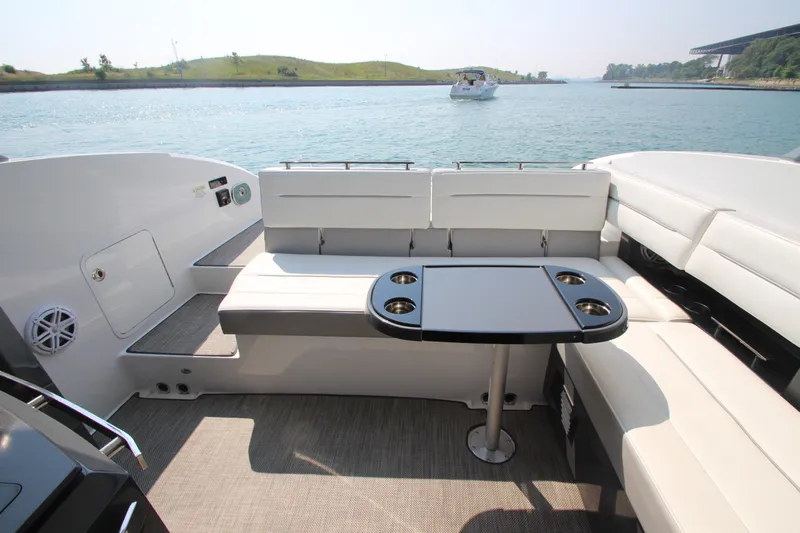  Yacht Photos Pics Luxurious seating area on a 2018 Cobalt A36 boat with scenic water view.