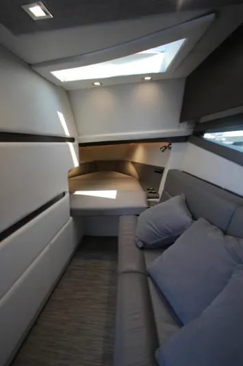  Yacht Photos Pics Interior of 2018 Cobalt A36 yacht, featuring modern design with cozy seating and skylight.