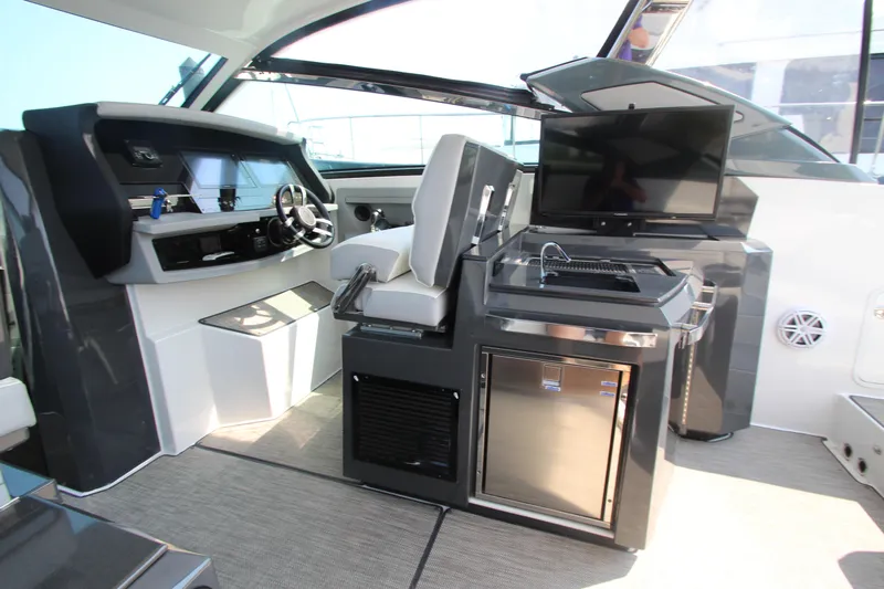  Yacht Photos Pics Interior of 2018 Cobalt A36 boat with helm, seating, and entertainment area.