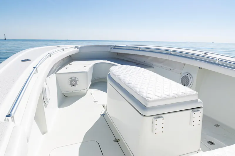  Yacht Photos Pics 2014 Yellowfin 36 Offshore boat interior with cushioned seating, open sea view.