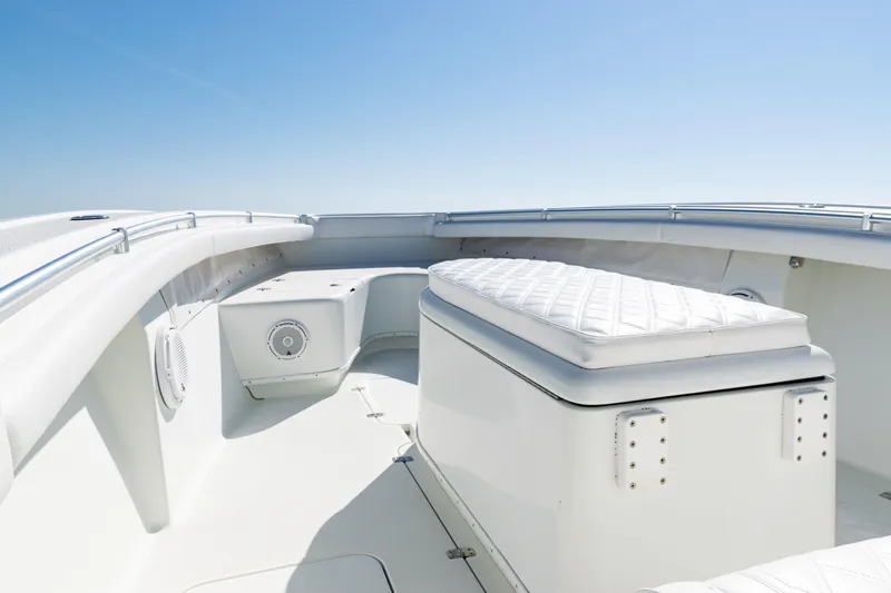  Yacht Photos Pics 2014 Yellowfin 36 Offshore boat interior with cushioned seating and sleek design.