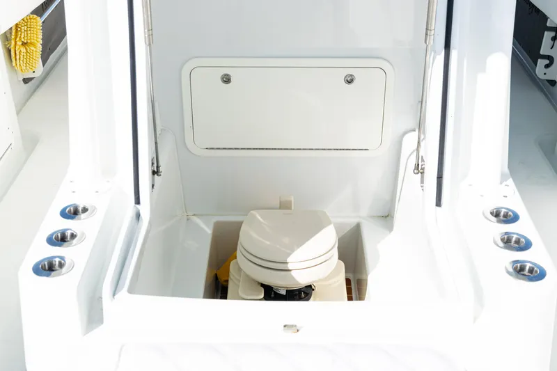  Yacht Photos Pics 2014 Yellowfin 36 Offshore boat interior with compact marine toilet.