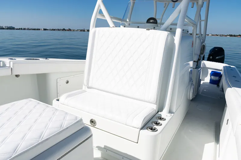  Yacht Photos Pics 2014 Yellowfin 36 Offshore boat interior with white seating and calm ocean backdrop.