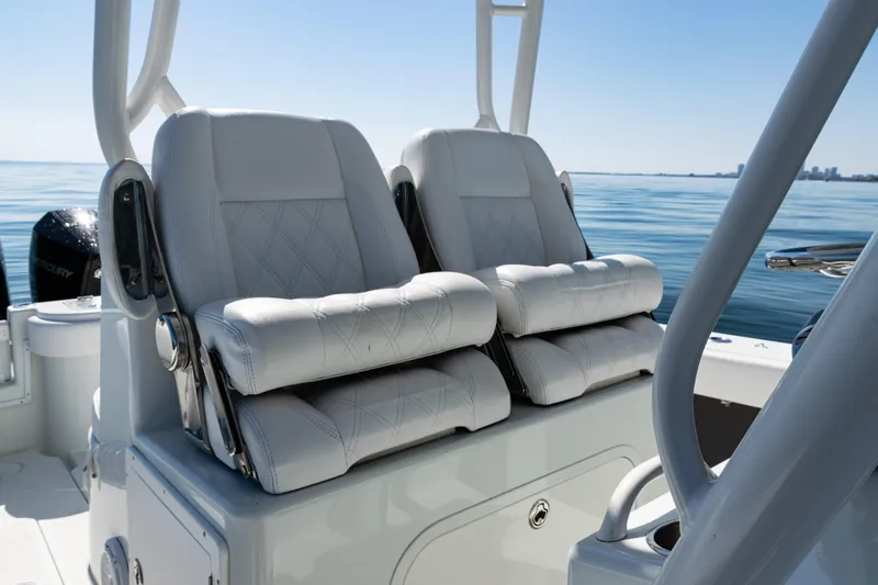  Yacht Photos Pics 2014 Yellowfin 36 Offshore boat with luxurious white seating on calm water.