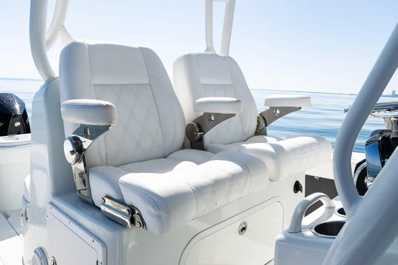  Yacht Photos Pics 2014 Yellowfin 36 Offshore boat with luxurious white seating and ocean backdrop.