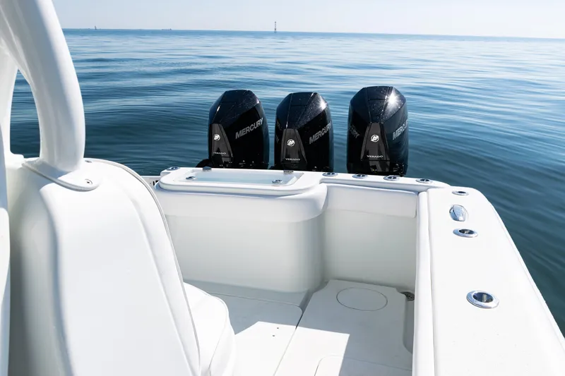  Yacht Photos Pics 2014 Yellowfin 36 Offshore boat with triple Mercury engines on calm sea.