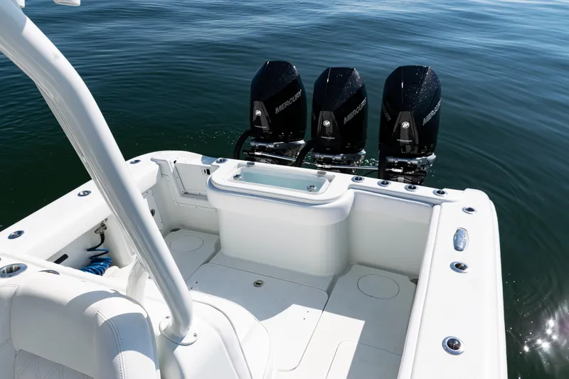  Yacht Photos Pics 2014 Yellowfin 36 Offshore boat with triple Mercury engines on calm water.