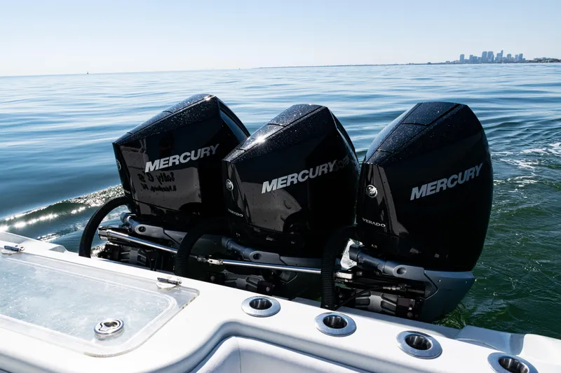  Yacht Photos Pics 2014 Yellowfin 36 Offshore boat with triple Mercury outboard engines on calm water.