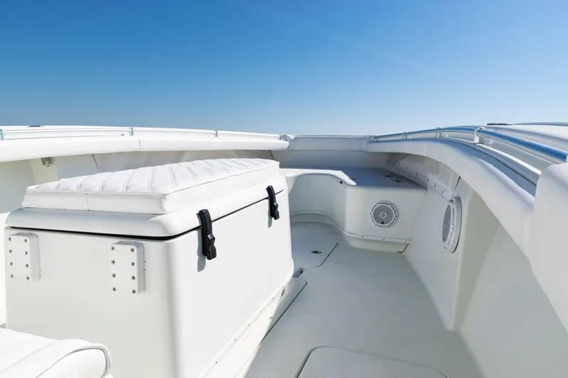  Yacht Photos Pics 2014 Yellowfin 36 Offshore boat interior with cushioned seating and clear blue sky.