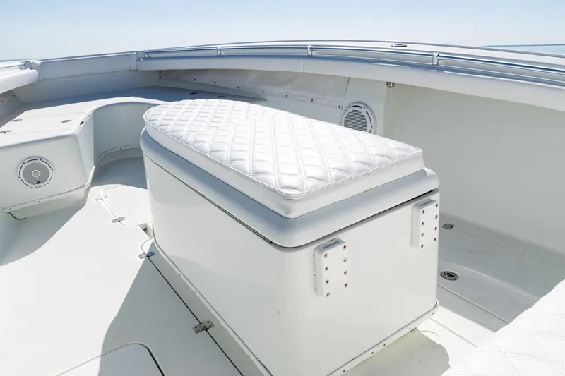  Yacht Photos Pics 2014 Yellowfin 36 Offshore boat interior with cushioned seating and storage.