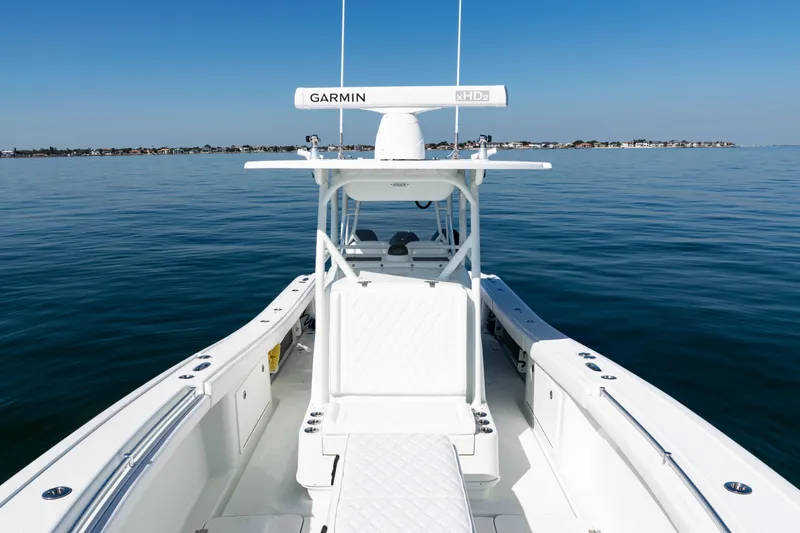  Yacht Photos Pics 2014 Yellowfin 36 Offshore boat on calm water, featuring Garmin equipment.