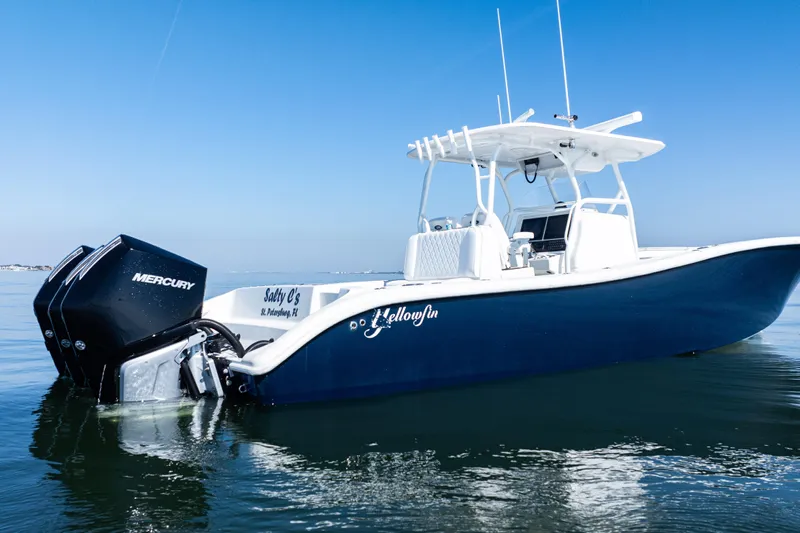  Yacht Photos Pics 2014 Yellowfin 36 Offshore boat with Mercury engines on calm water.