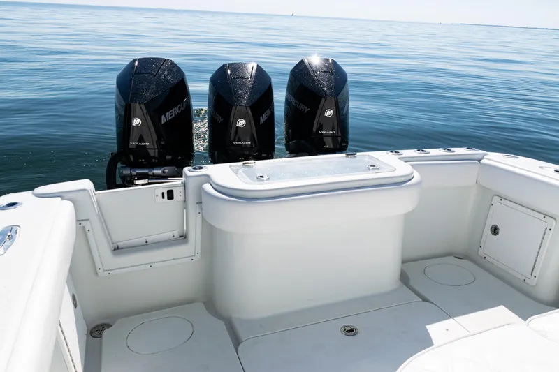  Yacht Photos Pics 2014 Yellowfin 36 Offshore boat with triple Mercury Verado engines on calm water.