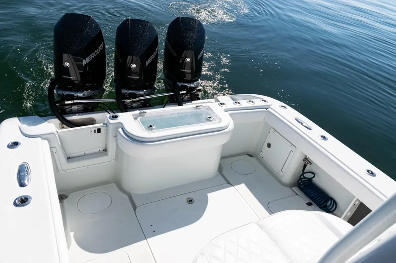  Yacht Photos Pics 2014 Yellowfin 36 Offshore boat with triple Mercury engines on calm water.