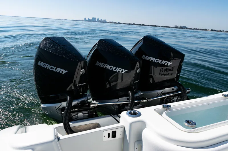  Yacht Photos Pics 2014 Yellowfin 36 Offshore with triple Mercury Verado engines on open water.