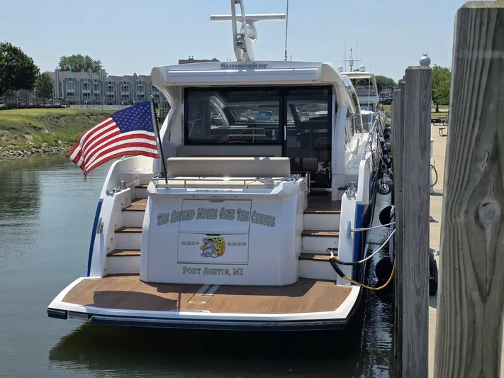  Yacht Photos Pics 2019 Sunseeker Predator 50 yacht docked, displaying American flag, Port Austin, MI.