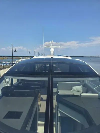  Yacht Photos Pics 2019 Sunseeker Predator 50 yacht docked, showcasing sleek design and luxurious interior.