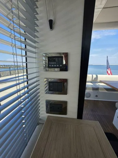  Yacht Photos Pics Interior controls of a 2019 Sunseeker Predator 50 yacht with ocean view.