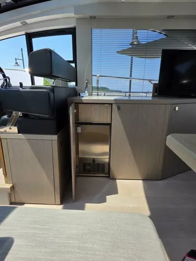  Yacht Photos Pics Interior of 2019 Sunseeker Predator 50 yacht with modern cabinetry and seating.
