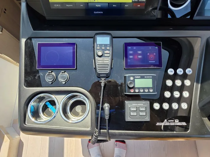  Yacht Photos Pics Control panel of 2019 Sunseeker Predator 50 yacht with navigation and communication systems.