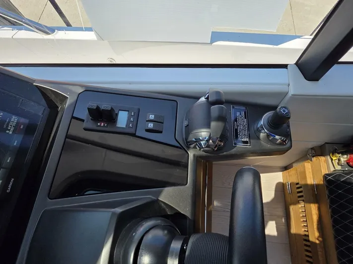  Yacht Photos Pics 2019 Sunseeker Predator 50 yacht helm controls with joystick and throttle levers.