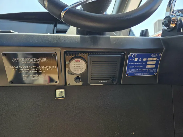  Yacht Photos Pics Control panel of a 2019 Sunseeker Predator 50 yacht with safety compliance plates.