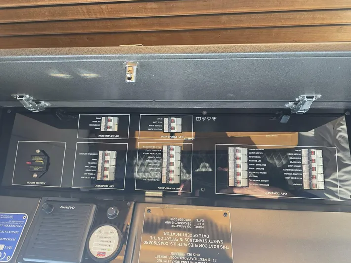  Yacht Photos Pics Electrical panel of 2019 Sunseeker Predator 50 yacht with labeled switches and controls.