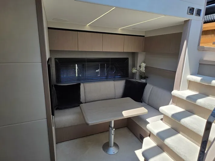  Yacht Photos Pics Luxurious interior of 2019 Sunseeker Predator 50 yacht with cozy seating and modern decor.