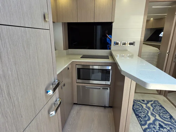  Yacht Photos Pics Modern kitchen in 2019 Sunseeker Predator 50 yacht with sleek cabinetry and appliances.