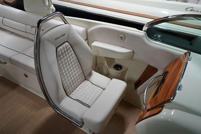  Yacht Photos Pics 2022 Chris-Craft Launch 25 GT interior with luxurious white seating and elegant wood accents.