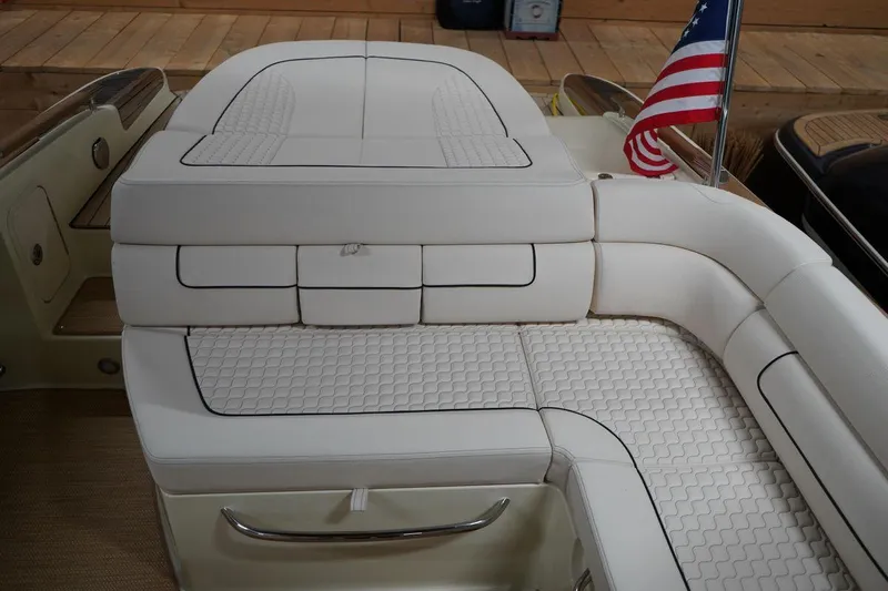  Yacht Photos Pics 2022 Chris-Craft Launch 25 GT boat with elegant white seating and American flag.