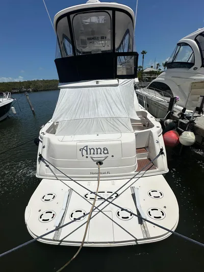 Anna Yacht Photos Pics 2001 Sea Ray 560 Sedan Bridge yacht docked, rear view with name "Anna" visible.