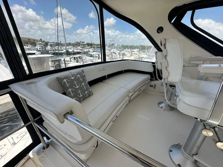 Anna Yacht Photos Pics Luxurious 2001 Sea Ray 560 Sedan Bridge interior with white seating and marina view.
