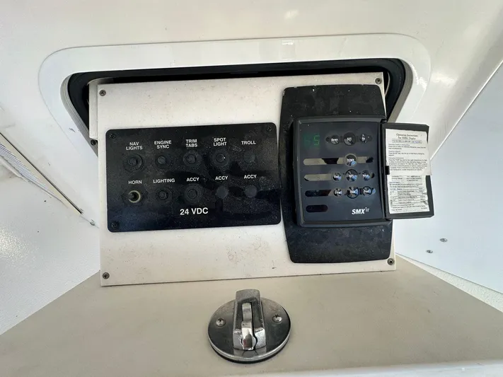 Anna Yacht Photos Pics Control panel of a 2001 Sea Ray 560 Sedan Bridge yacht, featuring various switches and dials.