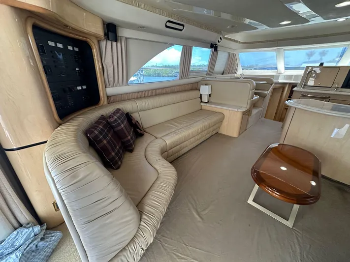 Anna Yacht Photos Pics Luxurious interior of a 2001 Sea Ray 560 Sedan Bridge yacht with plush seating.
