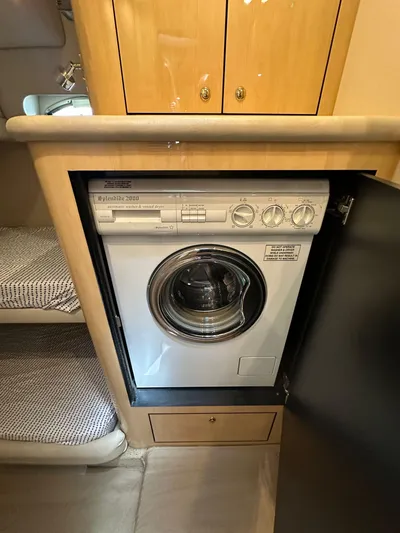 Anna Yacht Photos Pics Washing machine inside 2001 Sea Ray 560 Sedan Bridge yacht cabin.