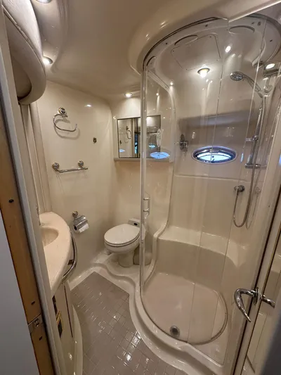 Anna Yacht Photos Pics Luxurious bathroom in 2001 Sea Ray 560 Sedan Bridge yacht with shower and modern fixtures.