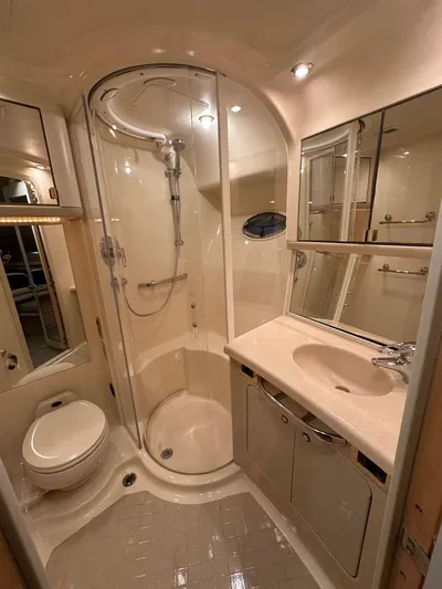 Anna Yacht Photos Pics Luxurious bathroom in 2001 Sea Ray 560 Sedan Bridge yacht with shower and vanity.