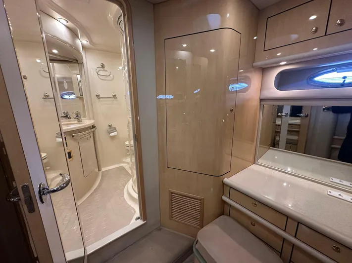 Anna Yacht Photos Pics Luxurious bathroom interior of 2001 Sea Ray 560 Sedan Bridge yacht, featuring elegant cabinetry and fixtures.
